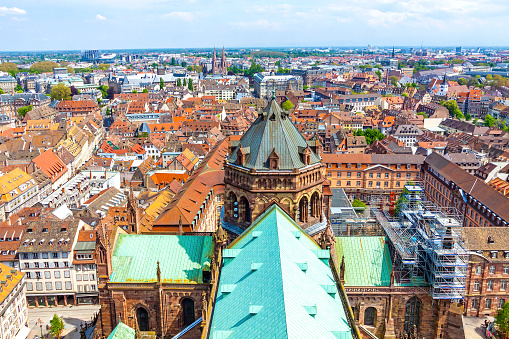 Skyline aerial view of Strasbourg old town, Grand Est region, France. Roofs of Strasbourg Cathedral on foreground. View to North-West side of the city