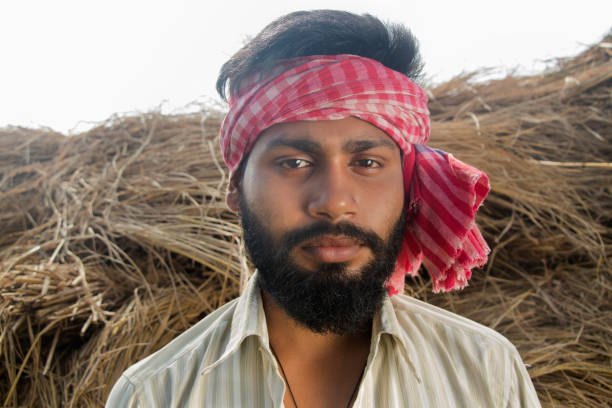 istock Indian Young Farmer Standing on his agriculture field 1327455278