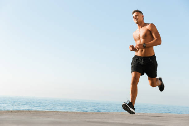 istock Smiling shirtless sportsman 1327456369