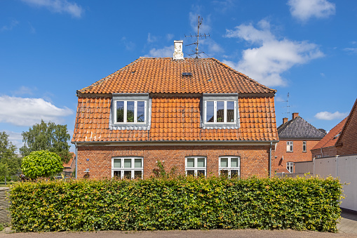 Detached red brick single family house in Nysted, which is a small town at the Danish island Lolland. This kind of houses are very popular all over Denmark