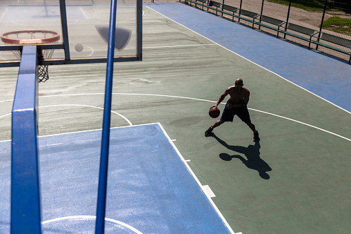 Basketball ball on the ground at sports field