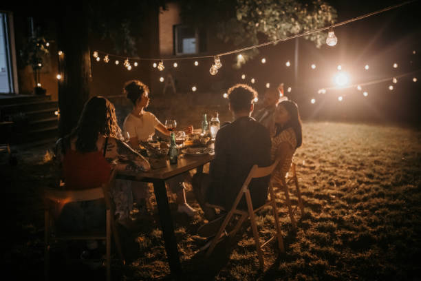 istock Friends on dinner party in back yard 1327459002