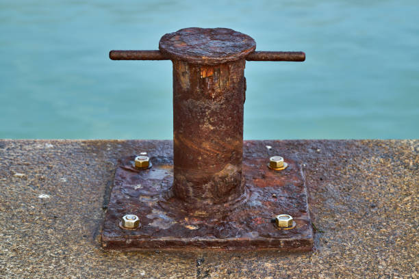 istock A heavily rusted samson post style single bitt mooring bollard for boats 1327459602