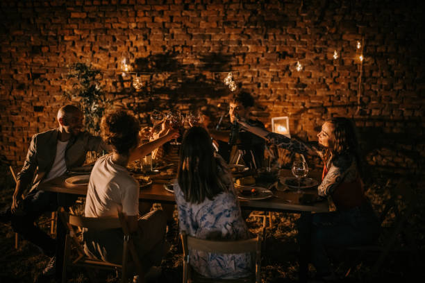 istock Friends on dinner party in back yard 1327460595