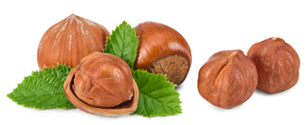 istock hazelnuts with green leaf isolated on white background macro. clipping path 1327463481