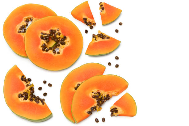 istock sliced ripe papaya fruit isolated on white background. exotic fruit. clipping path. top view 1327463599