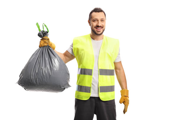 istock Waste collector holding a bin bag with gloves 1327464056