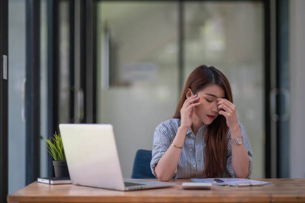 istock Asian businesswoman gets stressed while having a problem at work in the office. 1327464973