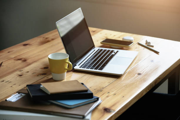 istock Working concept, computer, coffee mug, books and documents on the desk. 1327468025