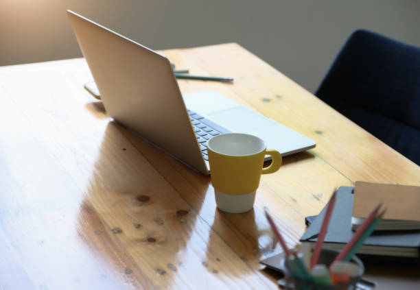 istock Working concept, computer, coffee mug, books and documents on the desk. 1327468073