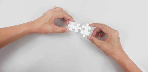 istock Holds in hand  jigsaw puzzle. Business solutions success 1327468116