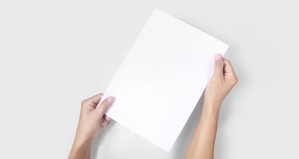 istock Hands holding paper blank for  letter paper 1327468126