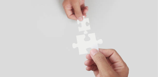 istock Holds in hand  jigsaw puzzle. Business solutions success 1327468128