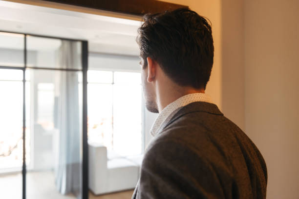 istock Side view of a young man in suit 1327469424