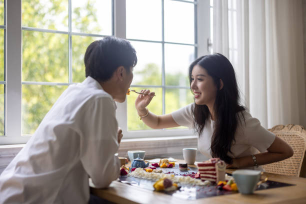 istock A couple dating in a coffee shop 1327470302