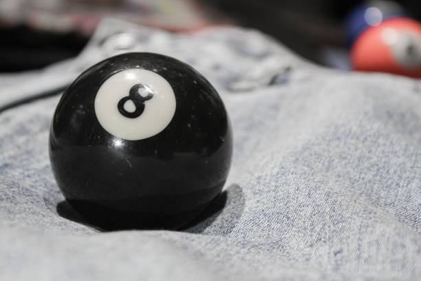 istock Billiard ball number eight on the jeans. Close up view. 1327470566
