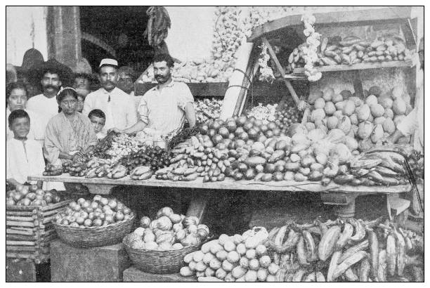 Antique black and white photograph: Fruit stand, Matanzas, Cuba Antique black and white photograph of people from islands in the Caribbean and in the Pacific Ocean; Cuba, Hawaii, Philippines and others: Fruit stand, Matanzas, Cuba cuban ethnicity photos stock illustrations