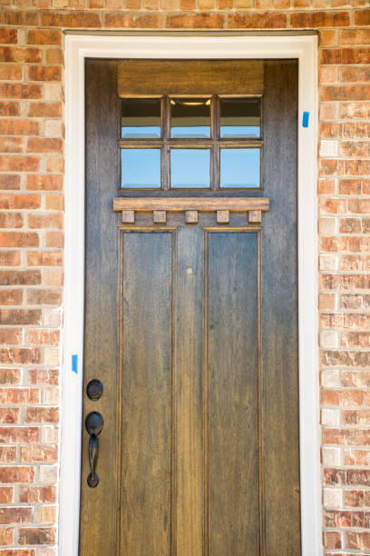 istock Wooden Front door on Brick Home 1327473929
