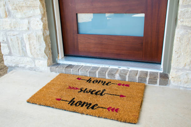istock Modern Door and Welcome Matt reading Home Sweat Home 1327473964