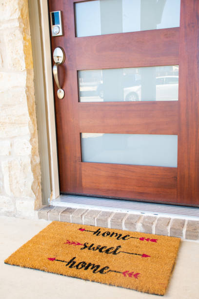 istock Modern Door and Welcome Matt reading Home Sweat Home 1327473988