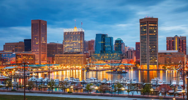View on Baltimore skyline and Inner Harbor from Federal Hill at dusk stock photo