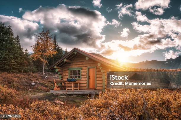 Sunrise On Wooden Hut In Autumn Forest At Assiniboine Provincial Park Stock Photo - Download Image Now
