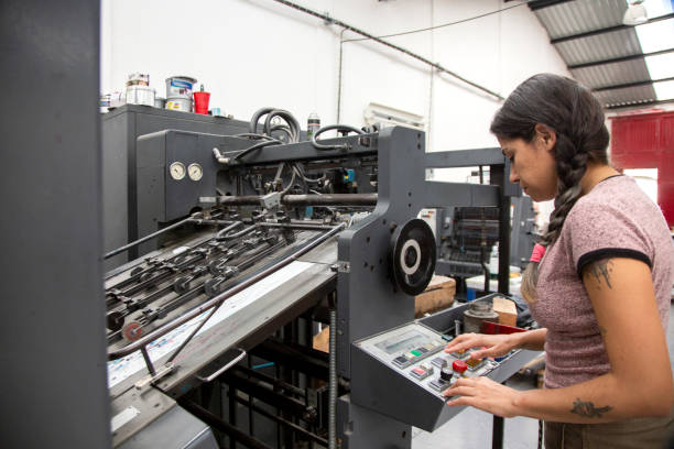 istock Young woman working in a printing press 1327475674