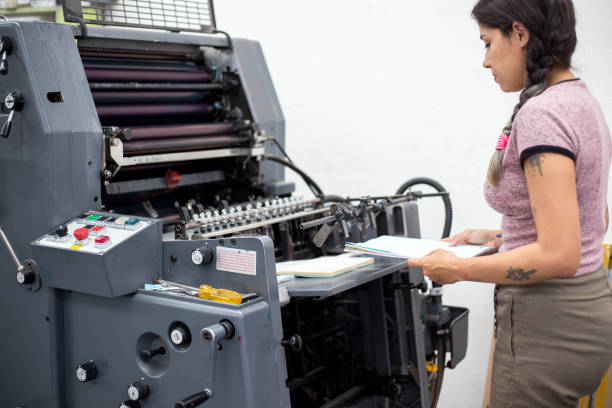 istock Young woman working in a printing press 1327475692