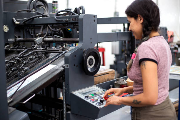 istock Young woman working in a printing press 1327475717