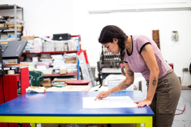 istock Young woman working in a printing press 1327475739
