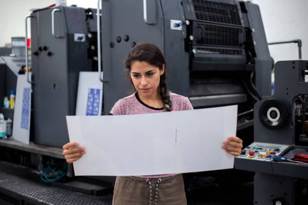 istock Young woman working in a printing press 1327475755