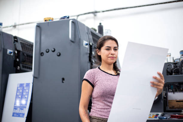 istock Young woman working in a printing press 1327475758