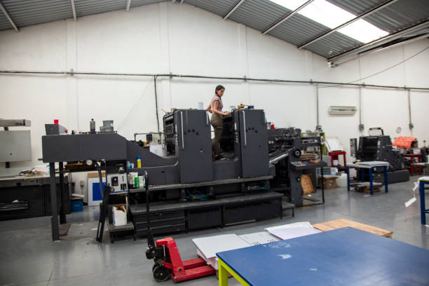 istock Young woman working in a printing press 1327475820