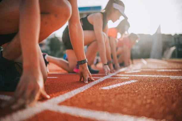 istock close up hand Asian chinese athletes lining up getting ready starting line running at track and run towards finishing line in the morning at track and field stadium 1327476844