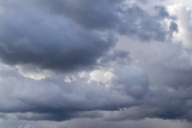 istock Grey cumulus clouds on blue sky before rain. 1327479000