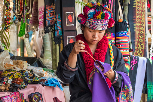 Woman from the Lahu tribe with traditional costume, selling souvenirs, Chiang Rai, Thailand, Asia