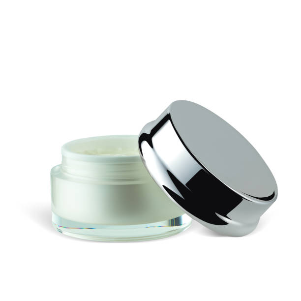 istock Opened jar of luxury face cream isolated on white background 1327480164