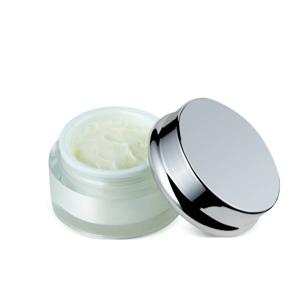 istock Opened jar of luxury face cream isolated on white background 1327480282