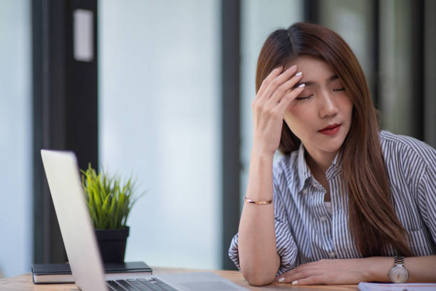 istock Asian businesswoman gets stressed while having a problem at work in the office. 1327481867