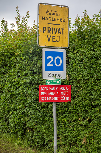Traffic sign saying private road and lookout for children in the outskirts of Nakskov which is the main city on the Danish island Lolland