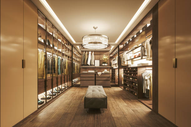 Modern Luxurious Walk-In Closet Interior Large walk-in closet of a luxurious home. garment store fashion rack stock pictures, royalty-free photos & images