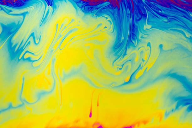 istock Rainbow colors. Psychedelic multi colored patterns background. Photo macro shot of soap bubbles 1327483101