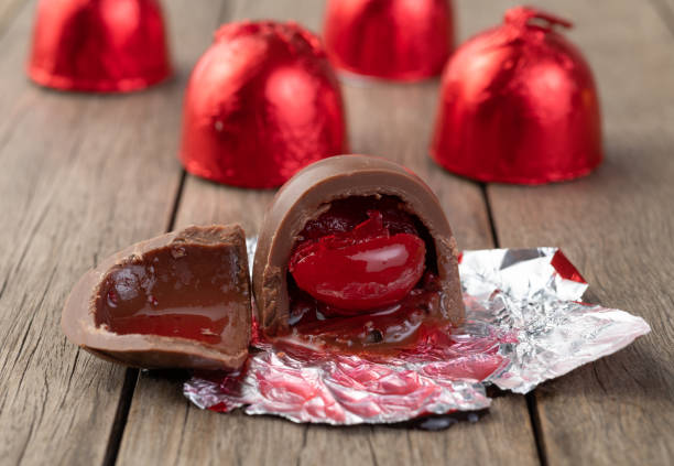 istock Cherry filled chocolate candy with candies packed in red foil paper 1327483272