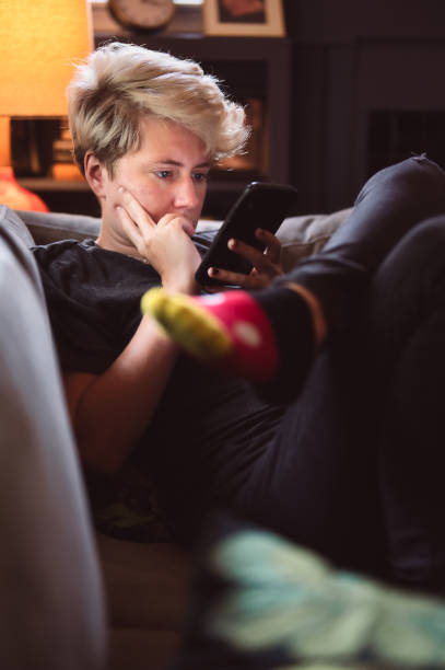 istock Young Person staring at cell phone 1327484117