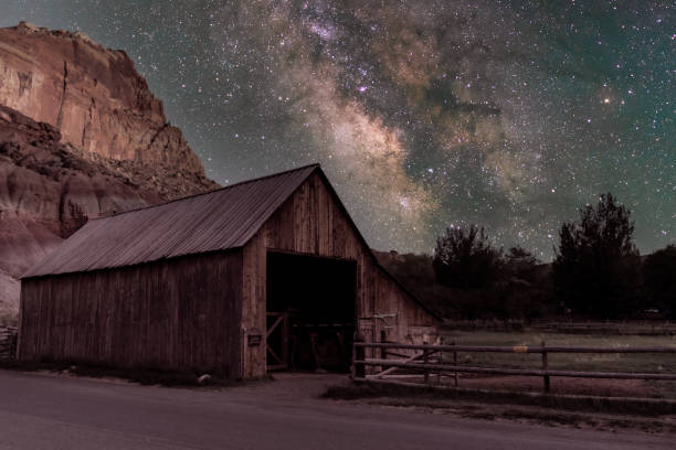 Milky Way over a Barn in Fruita at Capitol Reef National Park The Milky Way over a barn in Fruita in Capitol Reef National Park in Central Utah. capitol reef national park stock pictures, royalty-free photos & images