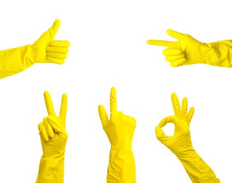 Hands in yellow rubber gloves show different gestures isolated on a white background