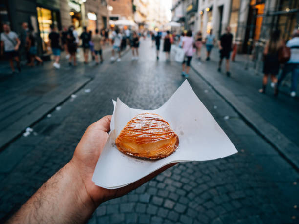 istock Pov view of a man holding a typical Neapolitan sfogliatella 1327485659