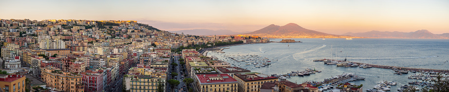 Naples at sunset - Gulf of Naples, Italy. View of the city from elevated point of view.
