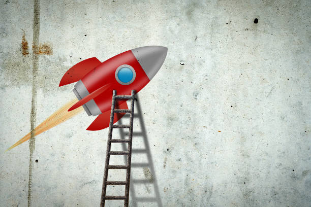 istock Space rocket on a concrete wall. Ladder to her. Concept of a new project. 1327486494