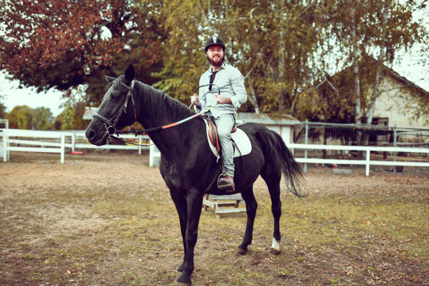 istock Smiling Male Happy With First Time Horse Riding Experience 1327487014